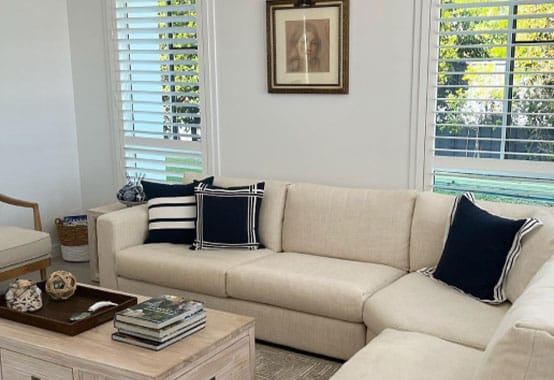 Living Room With Elite Plantation Shutters — Premium Window Coverings In Chevallum, QLD