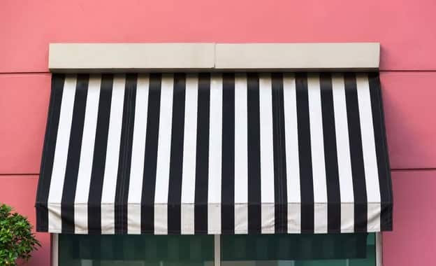Pink Wall With Black And White Awning — Premium Window Coverings In Chevallum, QLD