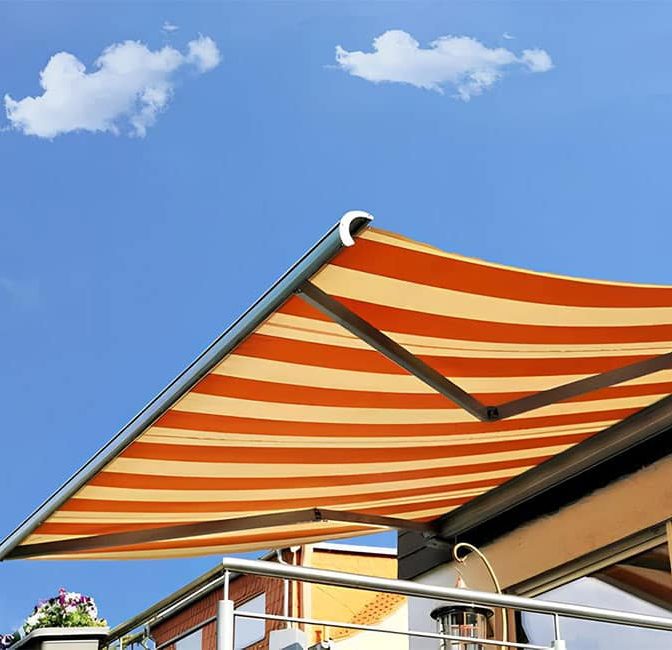 Folding Arm Awning With White And Red Stripes — Premium Window Coverings In Chevallum, QLD