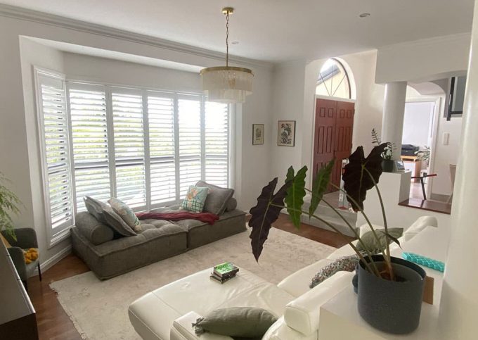 Bright Living Room with Window Shutters — Premium Window Coverings In Nambour, QLD