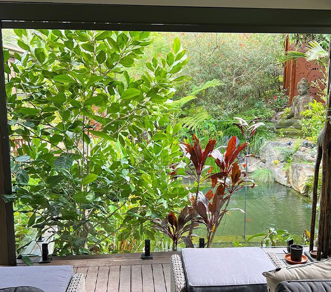 Outdoor Blinds In The Garden — Premium Window Coverings In Chevallum, QLD