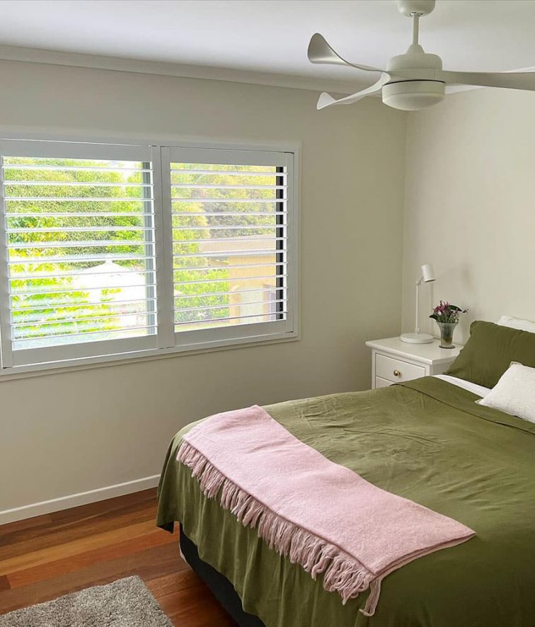 Plantation Shutters with Green Bed — Premium Window Coverings In Chevallum, QLD